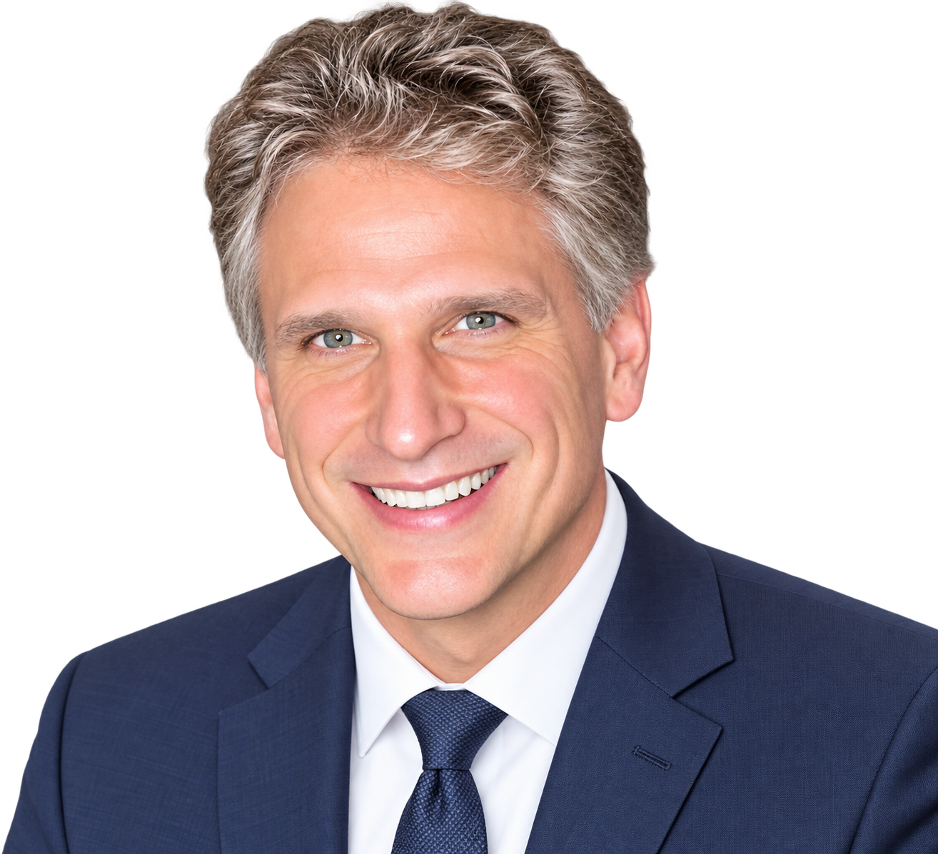 Team member headshot, smiling man in a navy tie